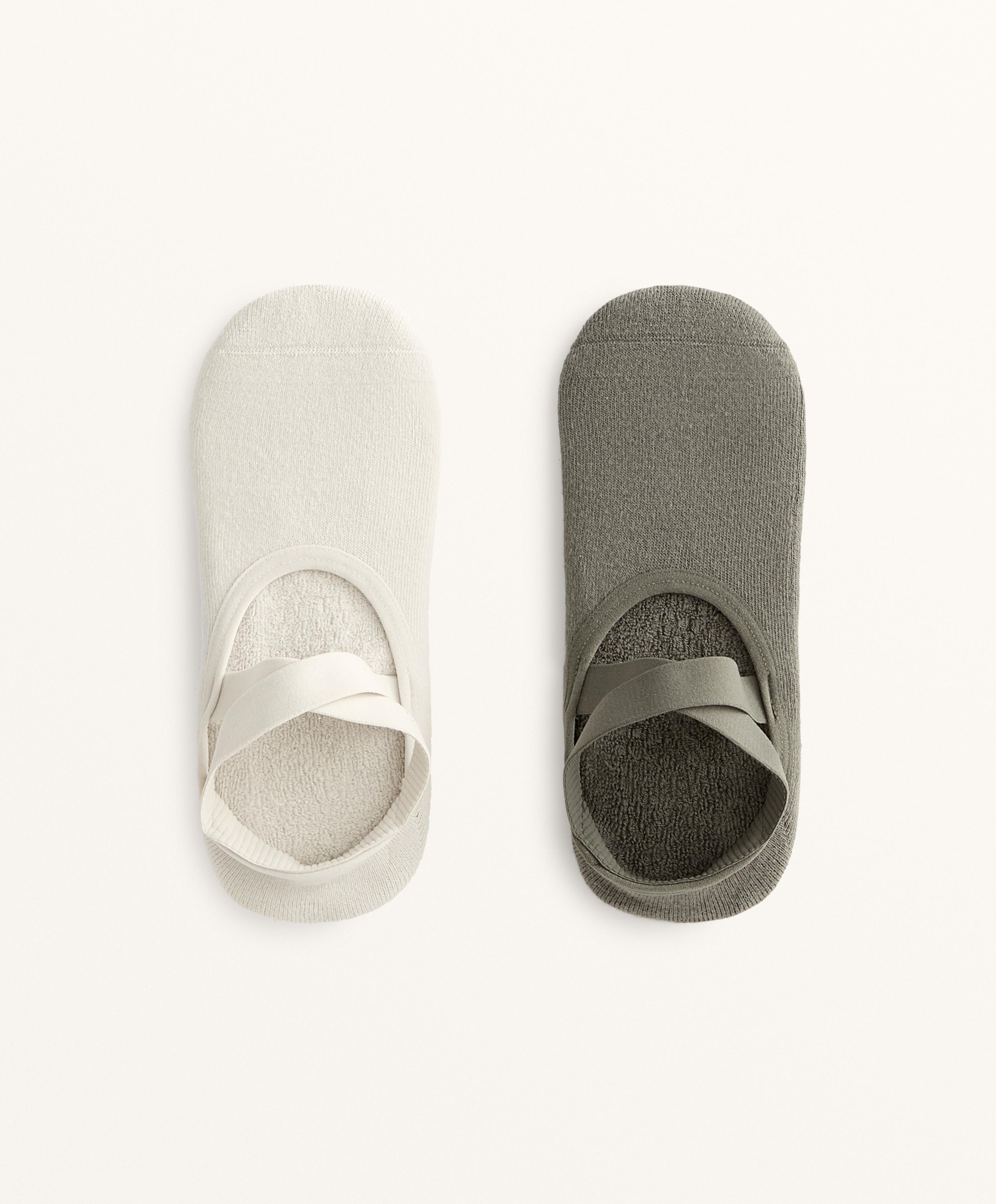 2 pairs of cotton blend yoga and Pilates socks with crossover straps